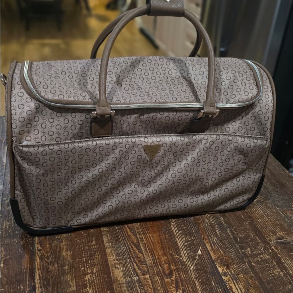 Guess Brown Patterned Duffel Bag wheeled can be used as carry on too